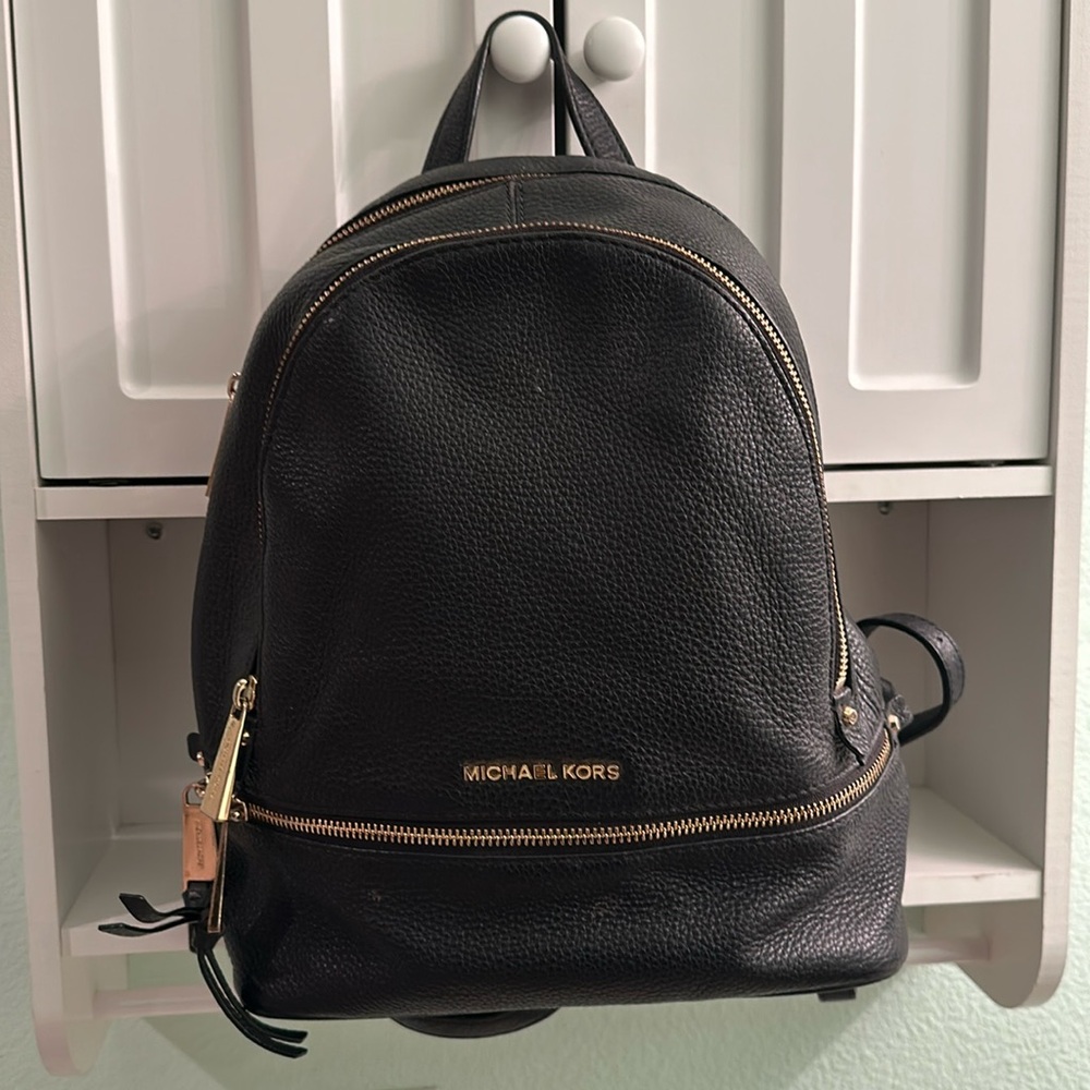 Michael Kors backpack purse, black with gold accents